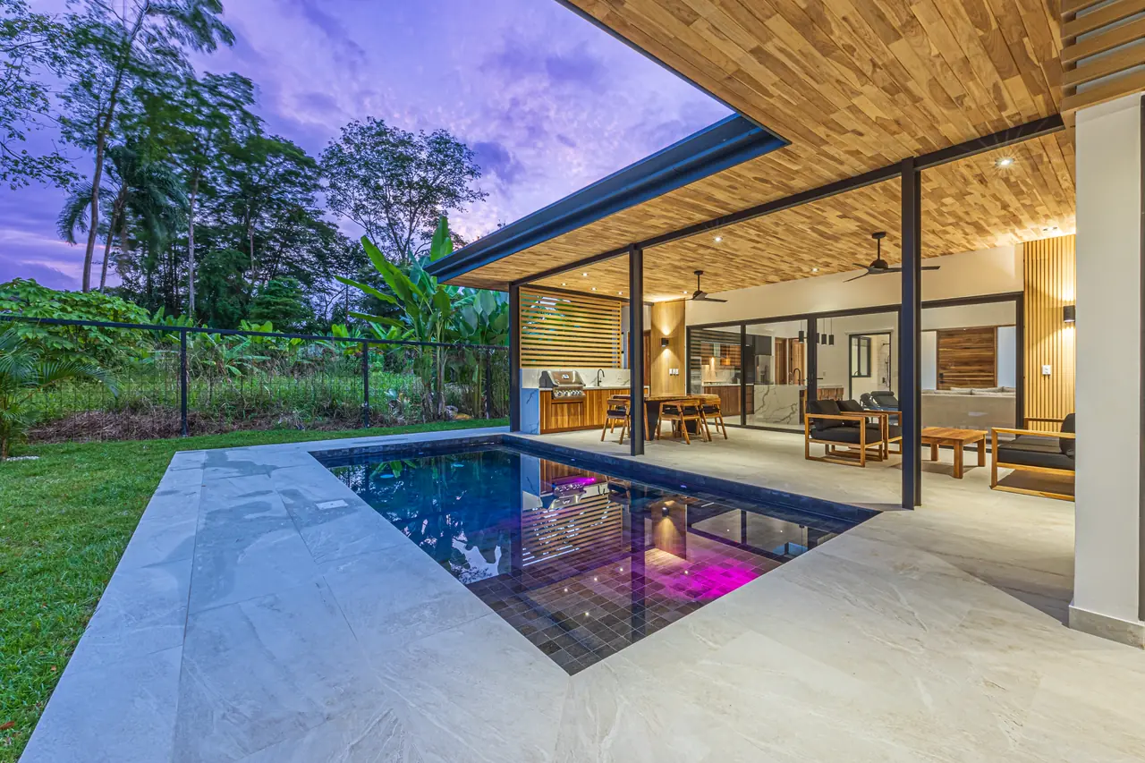 Wraparound pool deck under the butterfly roof