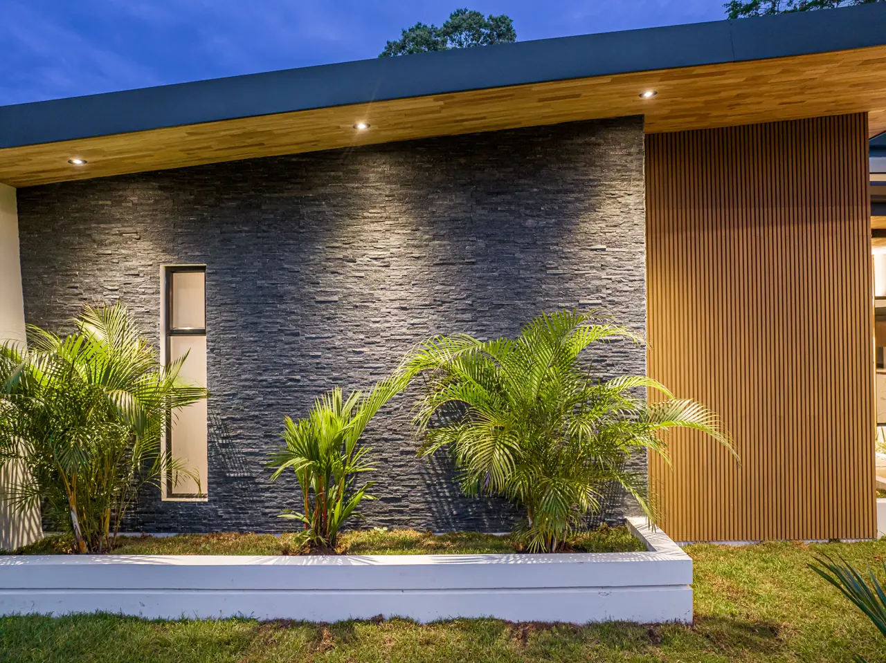 Stone feature wall, lit at night