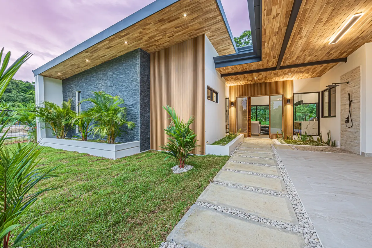 Entry approach with hardwood door and planting