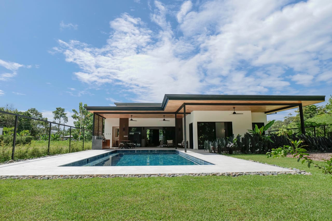 The 20 by 40 foot pool seen from the lawn, with the house behind it