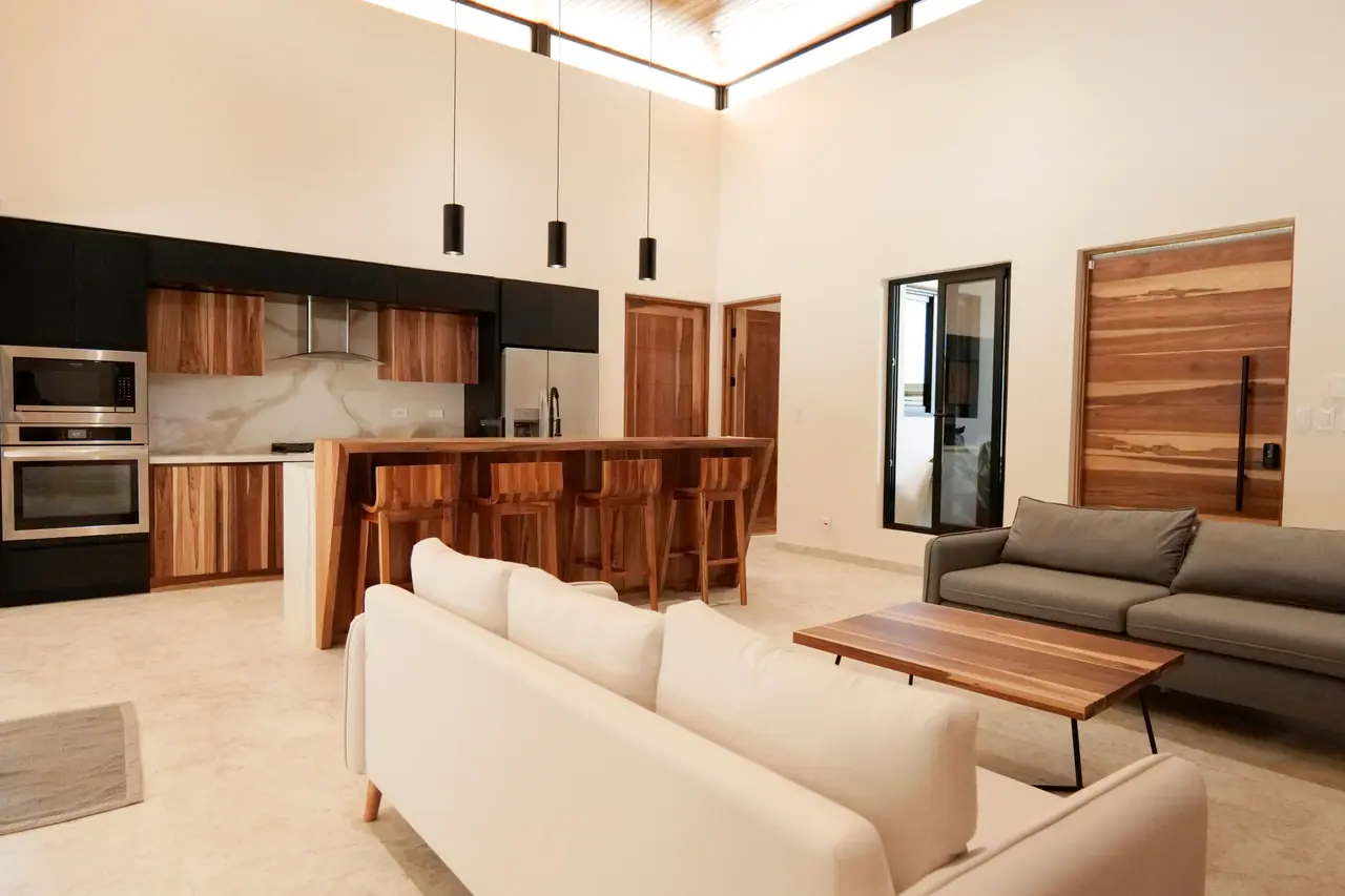 Living room and kitchen under the double-height ceiling